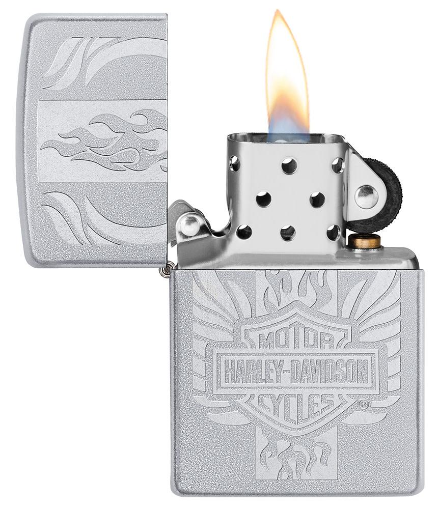 Harley-Davidson?« Luster Etch Satin Chrome Windproof Lighter with its lid open and lit.