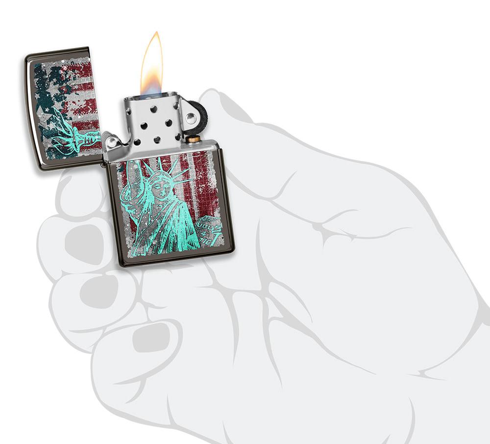 Statue Of Liberty Design Black Ice?« Windproof Lighter lit in hand.