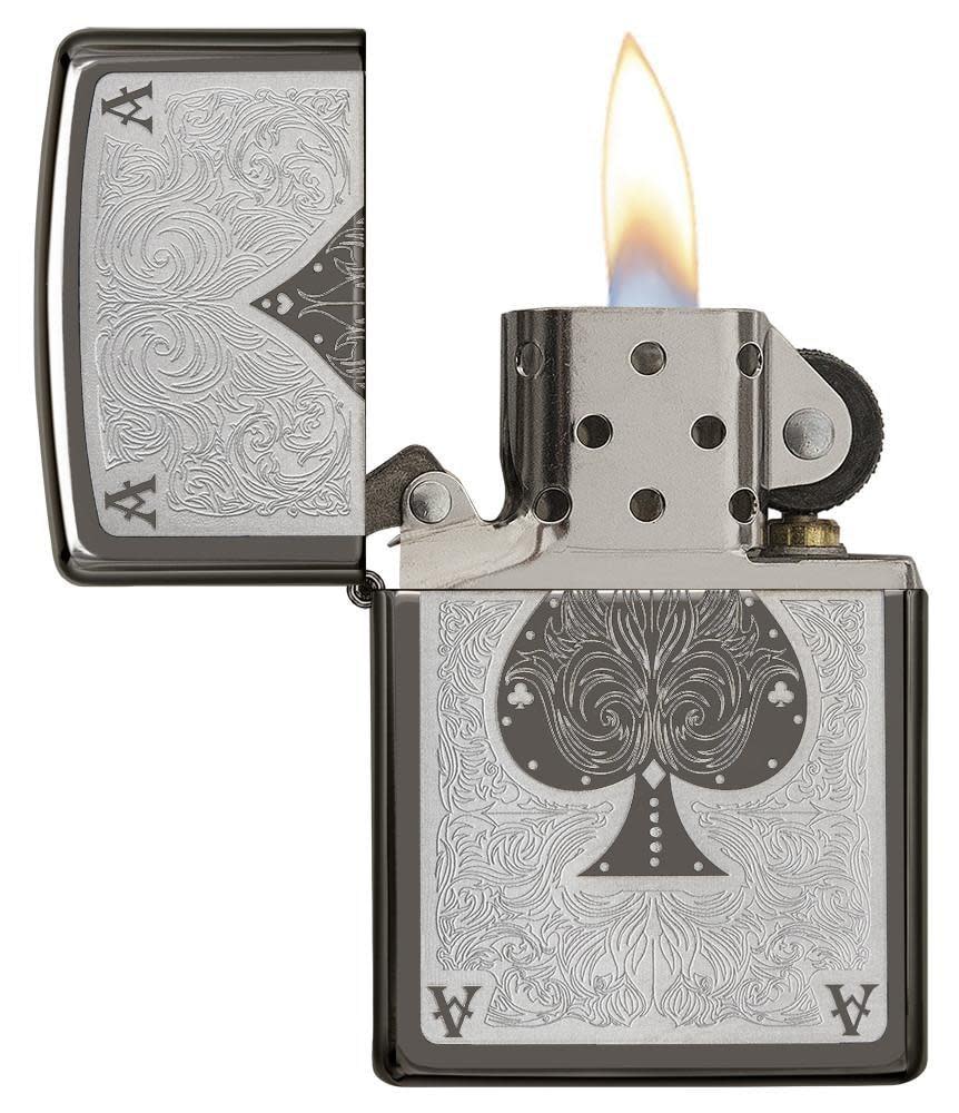 Ace Filigree Engraved Windproof Lighter with its lid open and lit