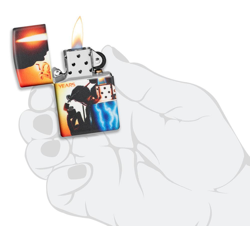 Mazzi?« 25th Anniversary 540 Color Windproof Lighter lit in hand.