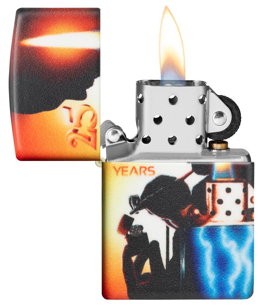 Mazzi?« 25th Anniversary 540 Color Windproof Lighter with its lid open and lit.