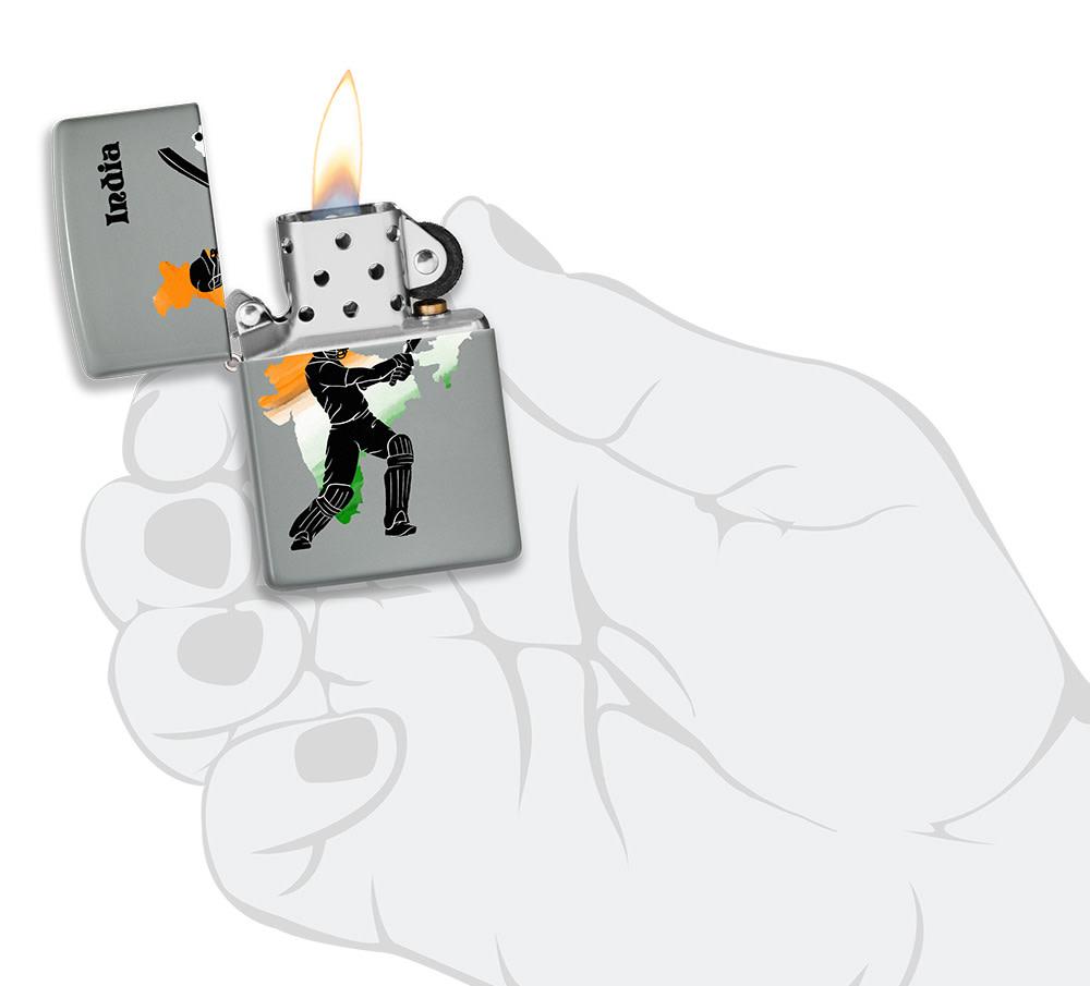 Cricket Player Design Windproof Pocket Light lit in hand.